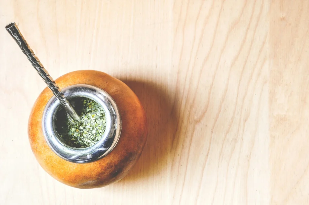 Traditional yerba mate tea calabash gourd cup with bombilla.